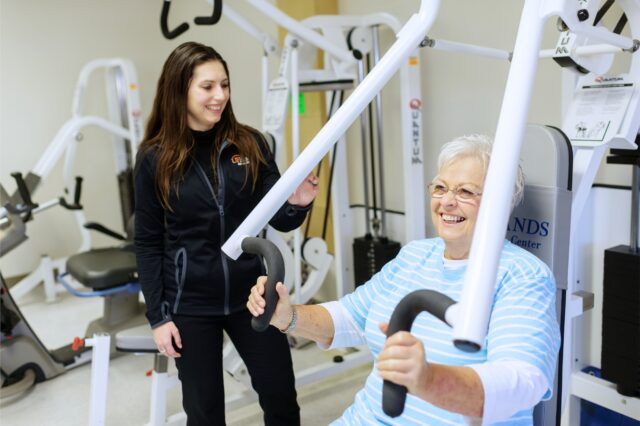Cardiac rehab patient lifting weights