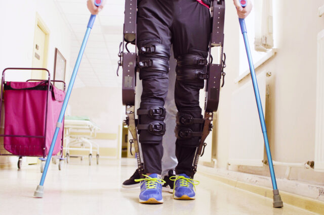 Man walking with crutches