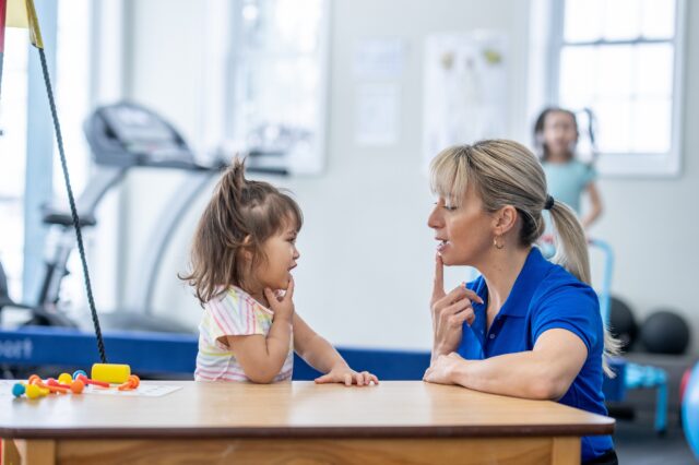 Speech pathologist working with a pediatric patient