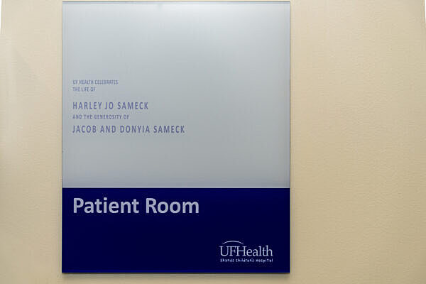 A plaque outside a door that reads "UF Health celebrates the life of Harley Jo Sameck and the generosity of Jacob and Donyia Sameck."