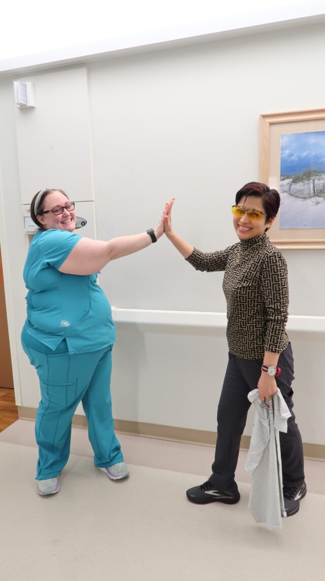 Mary Korth, RN, gives Bernadette Gloria, RN, a High Five for being a team player and a great leader.