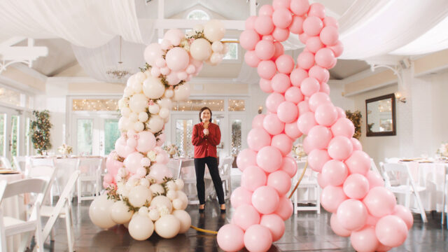 Courtney surrounded by pink balloons