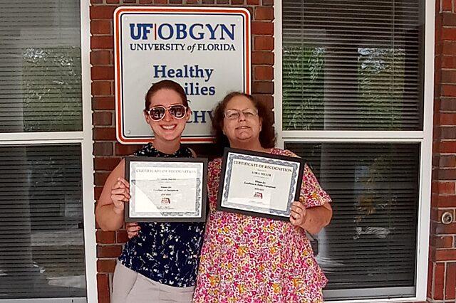 Amber Riess, left, was recognized by Healthy Families Florida for Excellence in Engagement. Lora Miller was recognized for Excellence in Father Engagement.