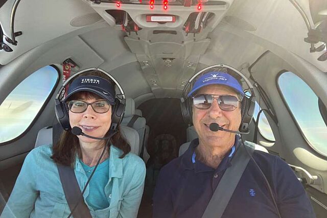 Amy and Harvey flying in a plane