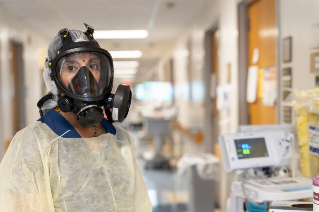 Doctor wearing gas mask