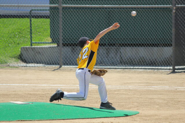 Kid throwing baseball