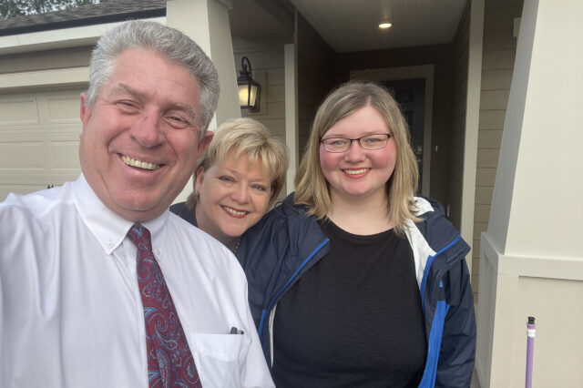 Emily and her parents, Doug and Janet Adkins, in 2021. (Photo courtesy of Adkins family.)