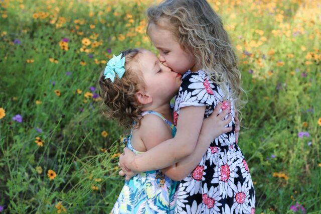 Two little girls hugging