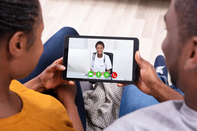 Couple on a telehealth call with a doctor