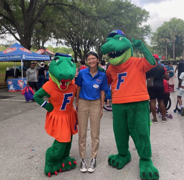 A Solace volunteer with Albert and Alberta, the UF Gator mascots.