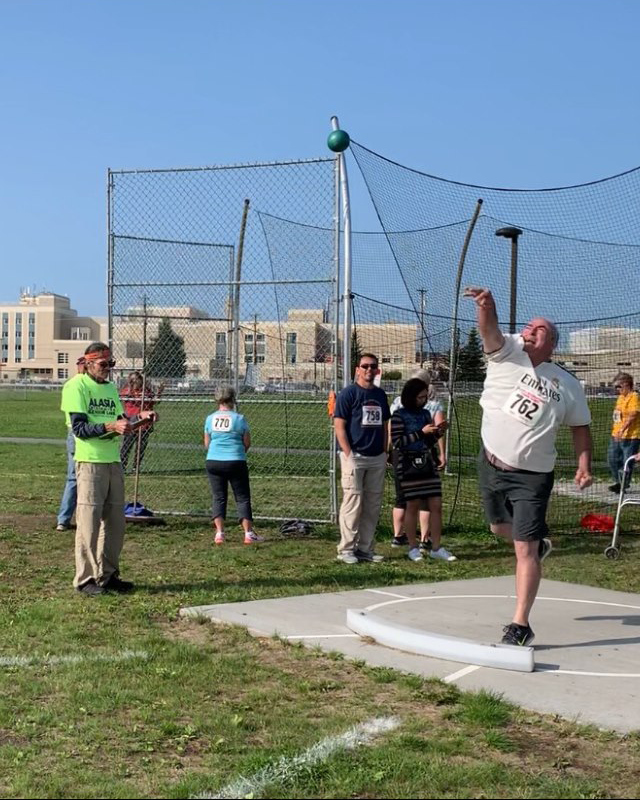 Cecil Cordell competes in a shot put event