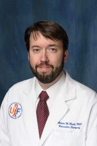 Adam Beck, M.D., a UF Health vascular surgeon and an assistant professor in the UF College of Medicine’s department of surgery