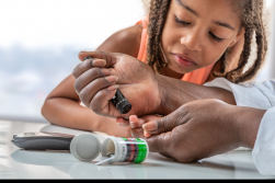 A young girl with diabetes learns how to test her blood sugar. As the number of new diabetes cases in children and teenagers rises nationwide, UF Health researchers are developing a new generation of tools to monitor diabetes in Florida youths and address disparities in diabetes diagnoses and care.  Photo credit: Adobe Stock