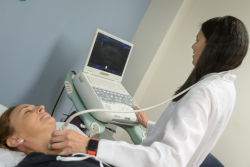Naykky Singh Ospina, M.D., an assistant professor in the UF College of Medicine’s division of endocrinology, diabetes and metabolism, performs an ultrasound in preparation for a thyroid cancer biopsy.
