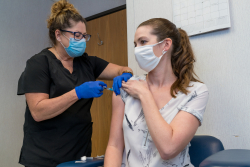 A UF Health staff member gets a flu shot recently. (Photo by Lou Brems)