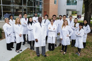 Members of the Preston A. Wells, Jr. Center for Brain Tumor Therapy at the University of Florida gather outside the McKnight Brain Institute at UF. (Copyright: University of Florida)