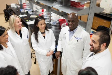 Dr. Duane Mitchell (second from the right) with his new faculty and staff in the Brain Tumor Research Program.