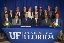 The new relationship between Shriners Hospitals for Children and UF Health was recognized Oct. 4 with a signing ceremony that included UF President Kent Fuchs, members of the SHC-Florida Board of Governors, and the members of UF Foundation Board of Directors.  Photo by Aaron Daye