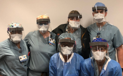 A group of anesthetists wear the completed shields.