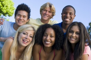 Teens smiling as they fight against bullying.