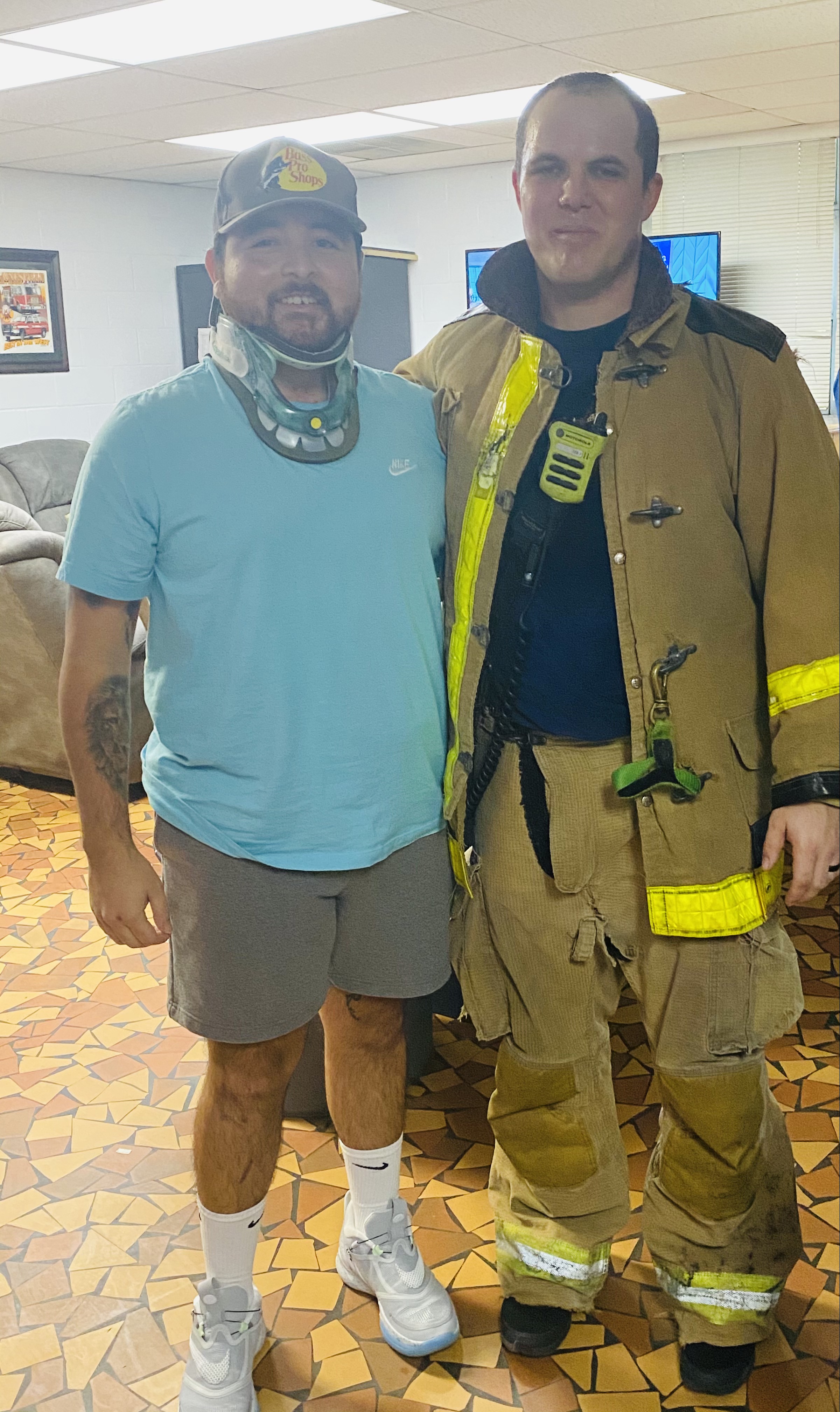 Matt visits with a firefighter after recovery