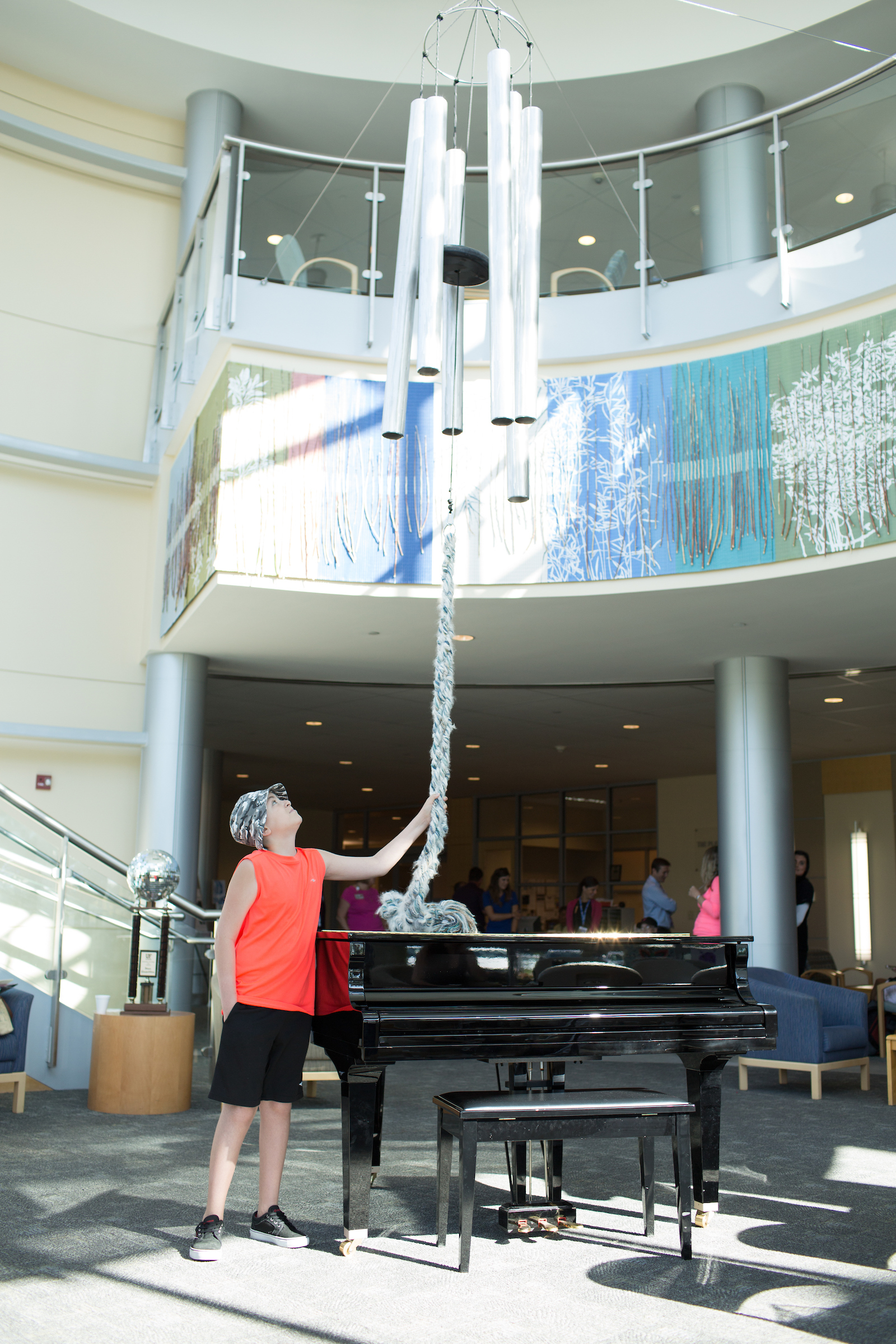 patient ringing chimes after completing proton therapy treatment