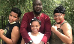 Akeem Thompson Sr. and his kids after getting vaccinated